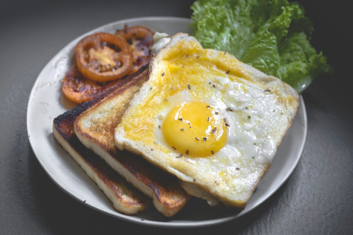 Healthy breakfast spread with fruit eggs and toast for kids