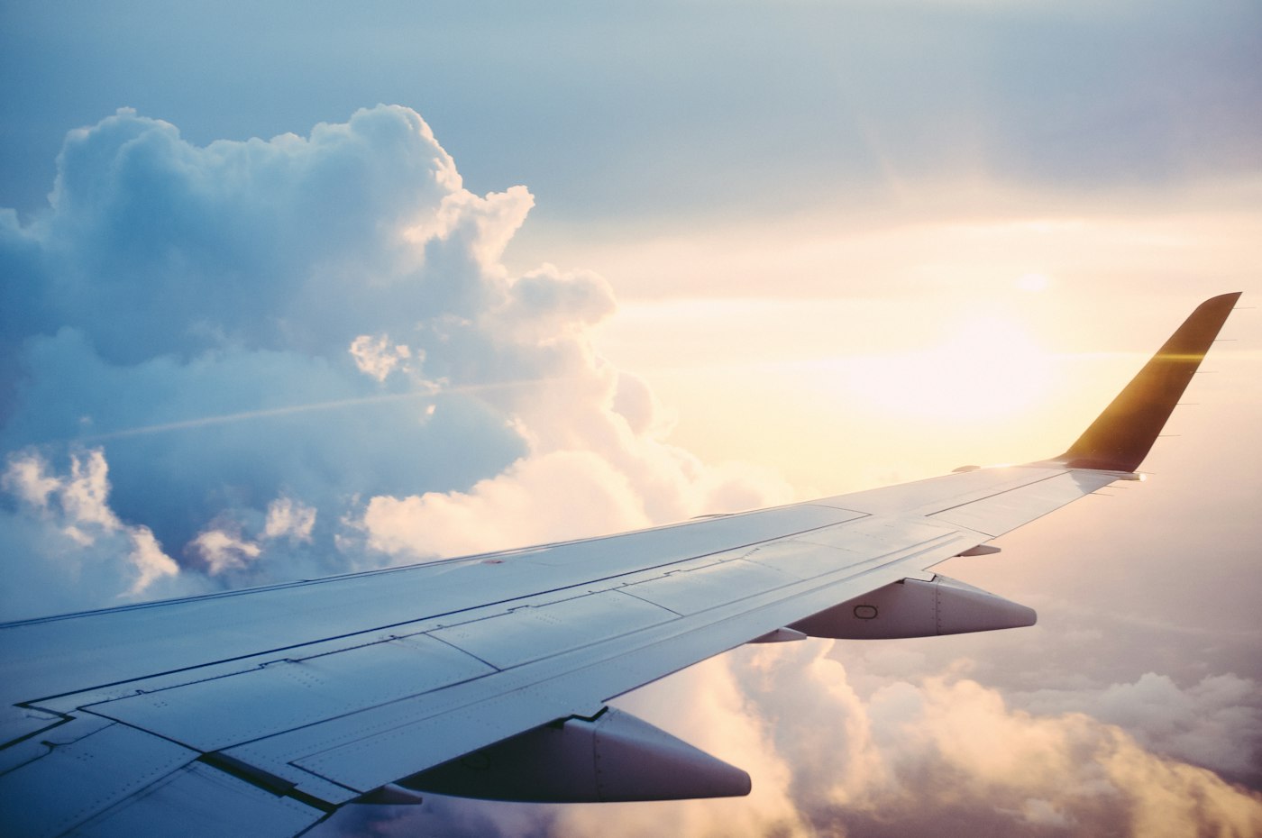 Airplane wing view during family air travel