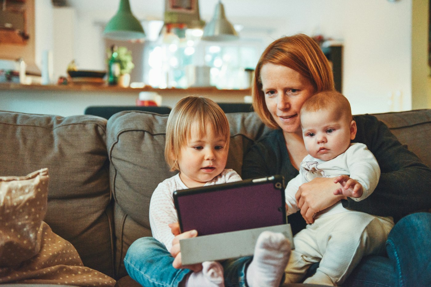 Parent helping young child with everyday family routines