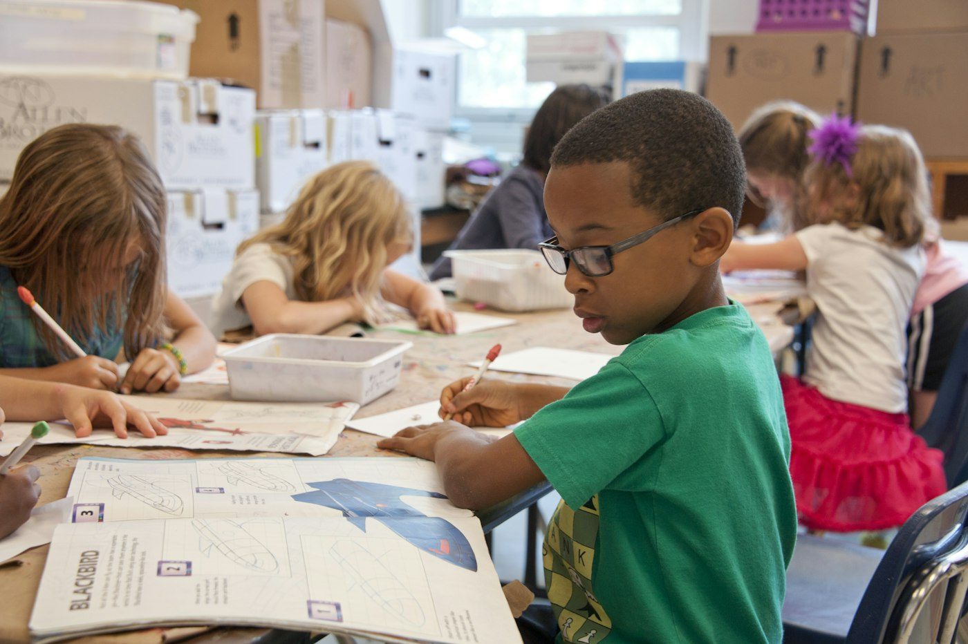 Kids learning with technology in classroom
